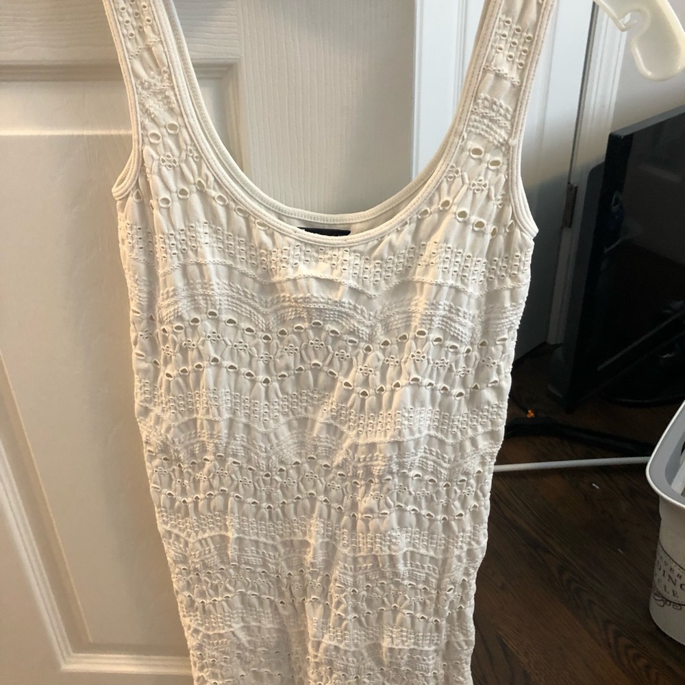 White fitted dress with patterns